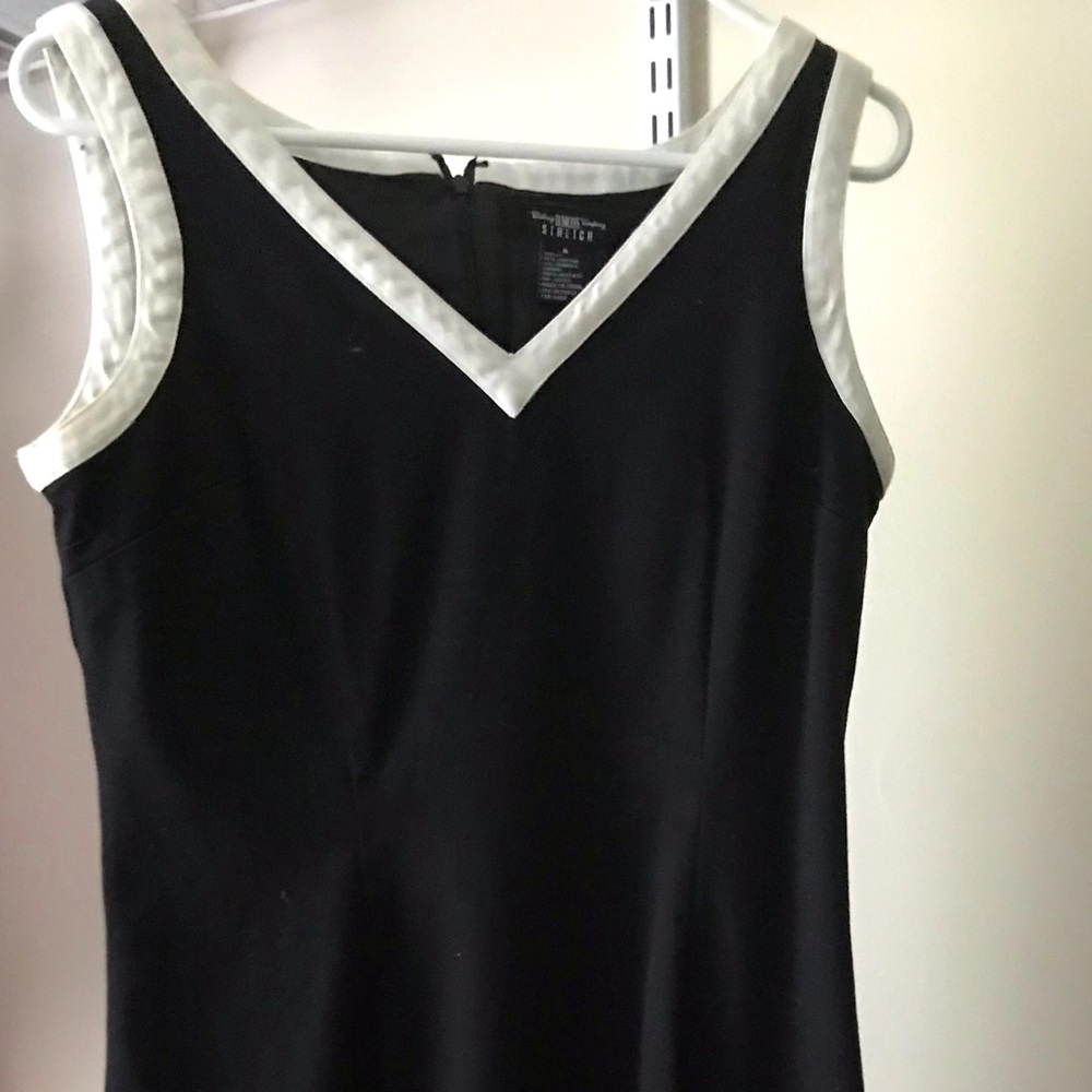 B. Moss black v-neck dress w/ white garnishing hem